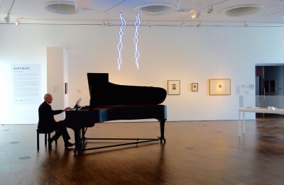David Pratley rehearsing 'In a Landscape – for Louise Lippold' by John Cage, performed at the opening of the exhibition